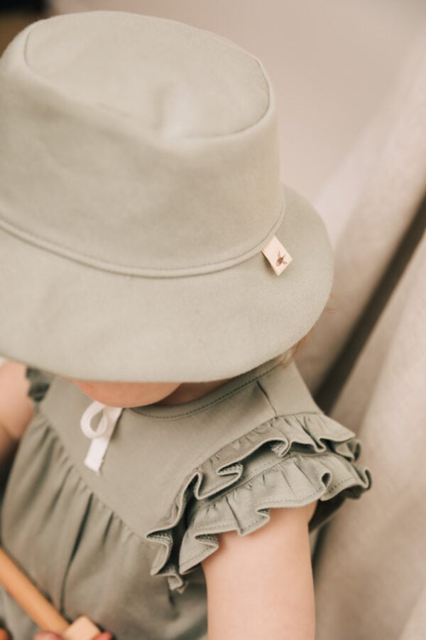 Baby wearing overall in pima cotton | UAUA Collections