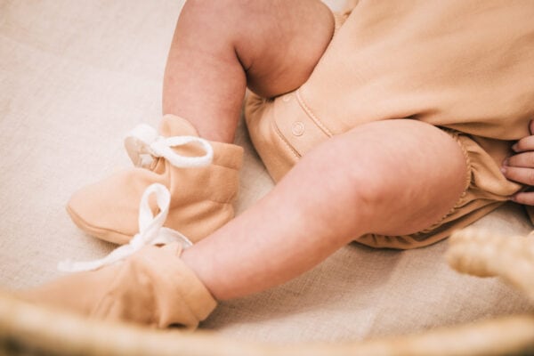 Baby wearing outfit and hair ribbon in pima cotton | UAUA Collections