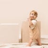 Baby wearing jumpsuit in pima cotton | UAUA Collections