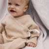 Baby wearing kimono footie in pima cotton | UAUA Collections