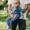 Baby wearing onesie in pima cotton in blue | UAUA Collections