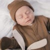 Newborn wearing onesie and baby hat in pima cotton | UAUA Collections