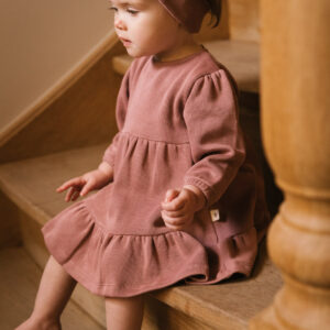 Baby girl wearing dress and hair ribbon in pima cotton - hibisco - Puno Collection | UAUA Collections