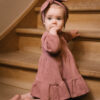 Toddler wearing dress and hair ribbon in pima cotton - hibisco - Puno Collection | UAUA Collections