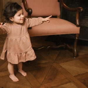 Toddler wearing dress in pima cotton - biscotti - Puno Collection | UAUA Collections