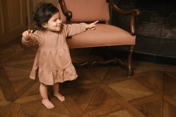 Toddler wearing dress in pima cotton - biscotti - Puno Collection | UAUA Collections