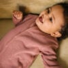 Toddler wearing basic footie in pima cotton - hibisco - Puno Collection | UAUA Collections