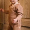 Toddler wearing footie in pima cotton - biscotti - Puno Collection | UAUA Collections