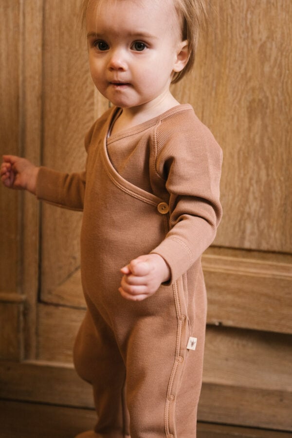 Toddler wearing footie in pima cotton - biscotti - Puno Collection | UAUA Collections