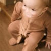 Baby wearing basic footie in pima cotton - biscotti - Puno Collection | UAUA Collections