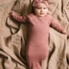 Baby girl wearing gown and baby bow in pima cotton - hibisco - Puno Collection | UAUA Collections