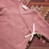 Baby wearing footie and baby hat in pima cotton - hibisco - Puno Collection | UAUA Collections